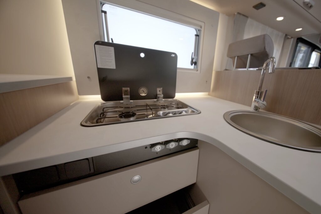 Carado motorhome kitchen with gas hob, sink, worktop and window