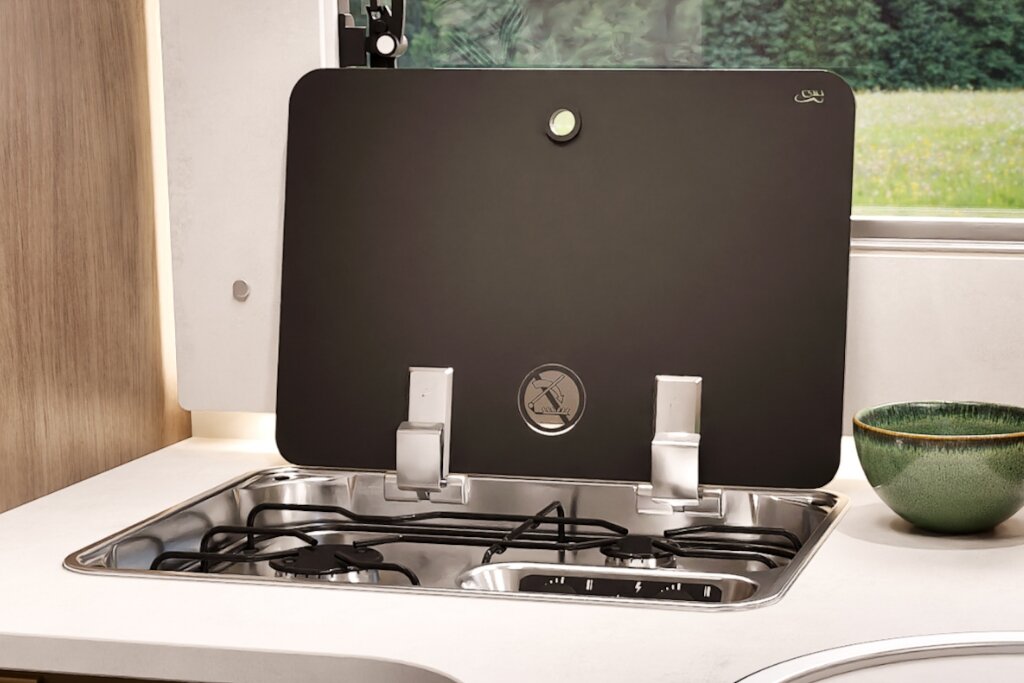 Carado motorhome hob with glass cover, two gas burners and a stainless-steel frame in the kitchen unit