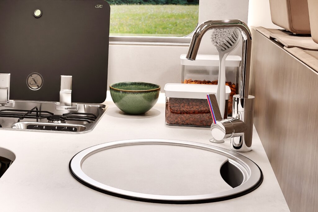 Carado motorhome kitchen with round sink, tap and two-burner gas hob